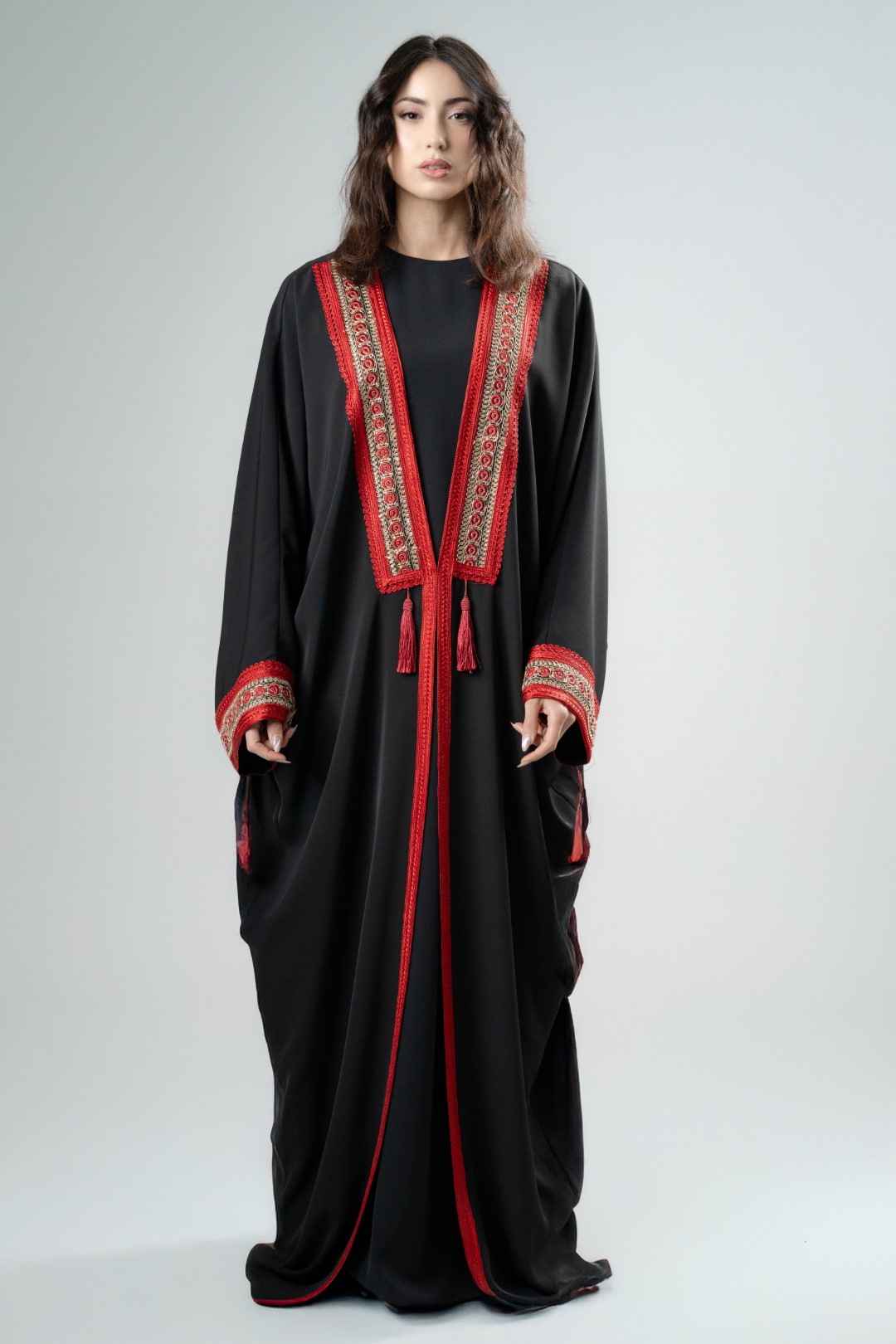 Black kimono with red tassels