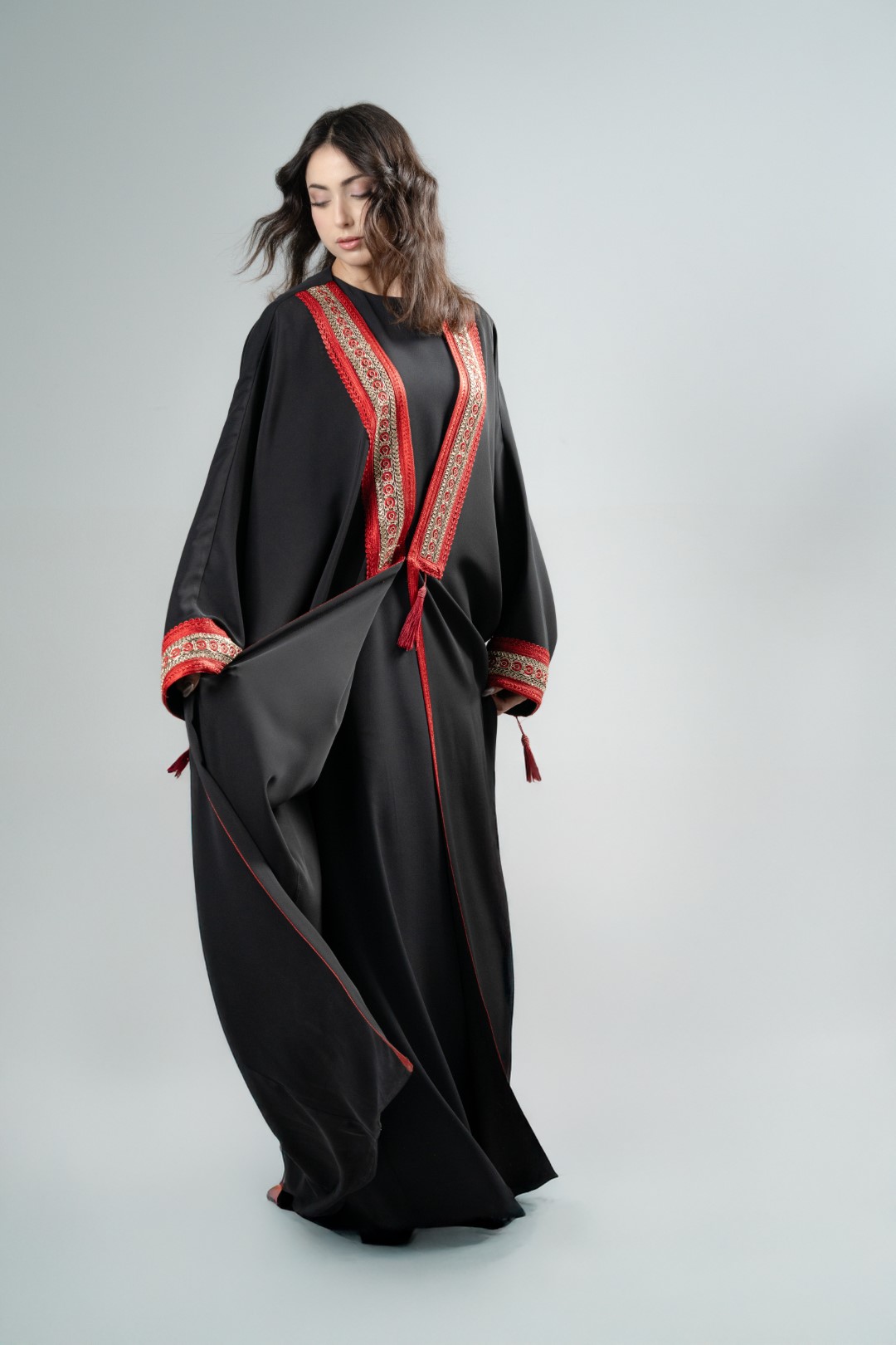Black kimono with red tassels