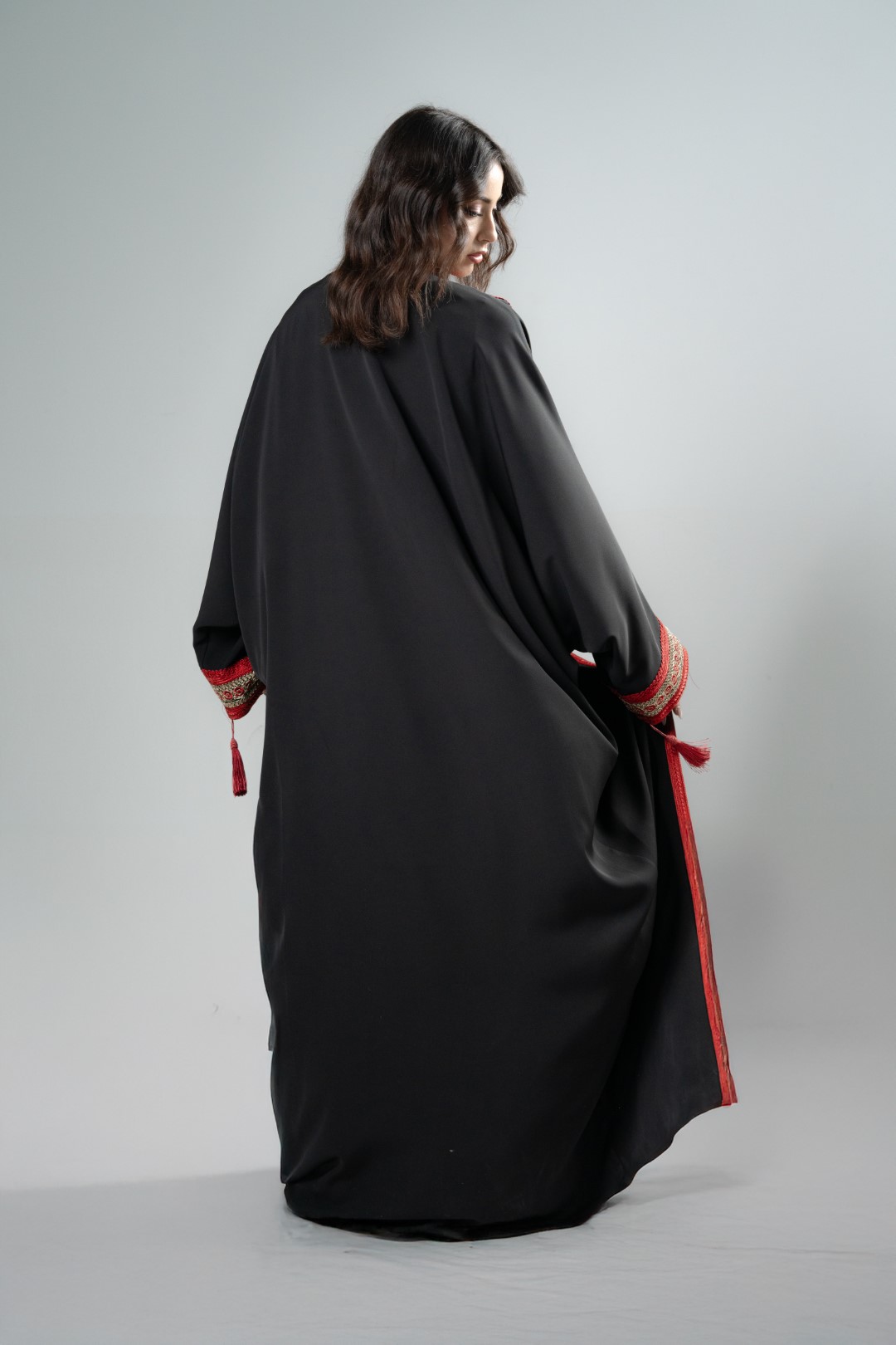 Black kimono with red tassels
