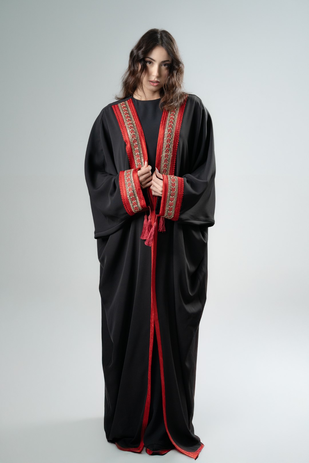 Black kimono with red tassels
