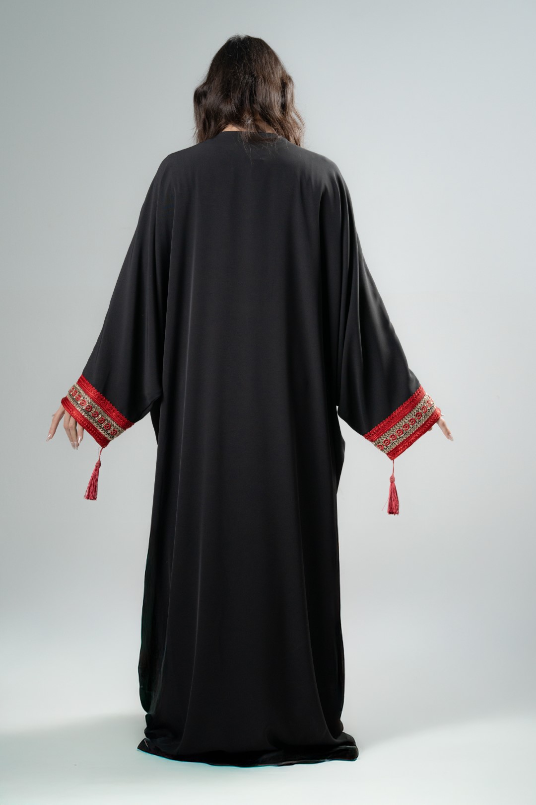 Black kimono with red tassels