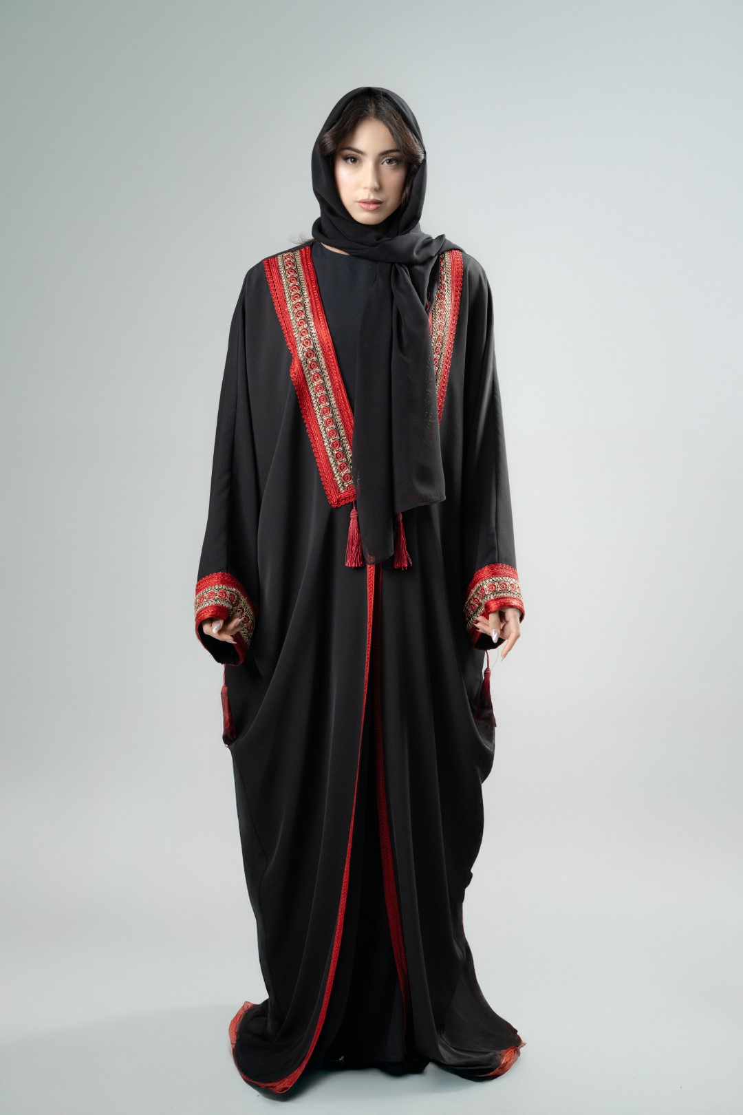 Black kimono with red tassels