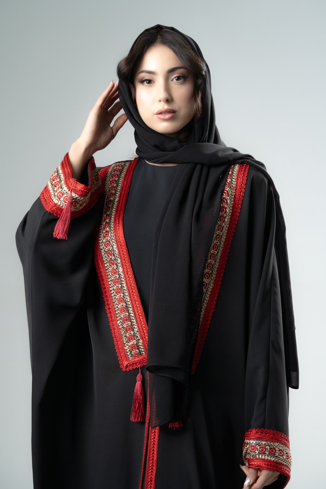 Black kimono with red tassels