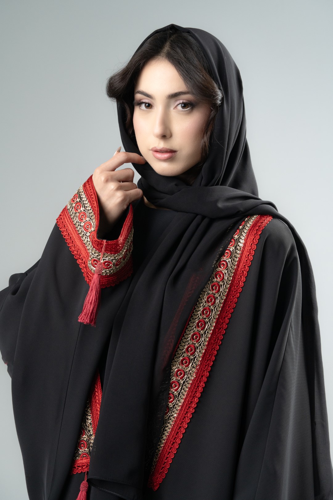 Black kimono with red tassels