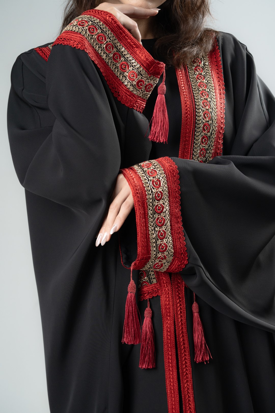 Black kimono with red tassels