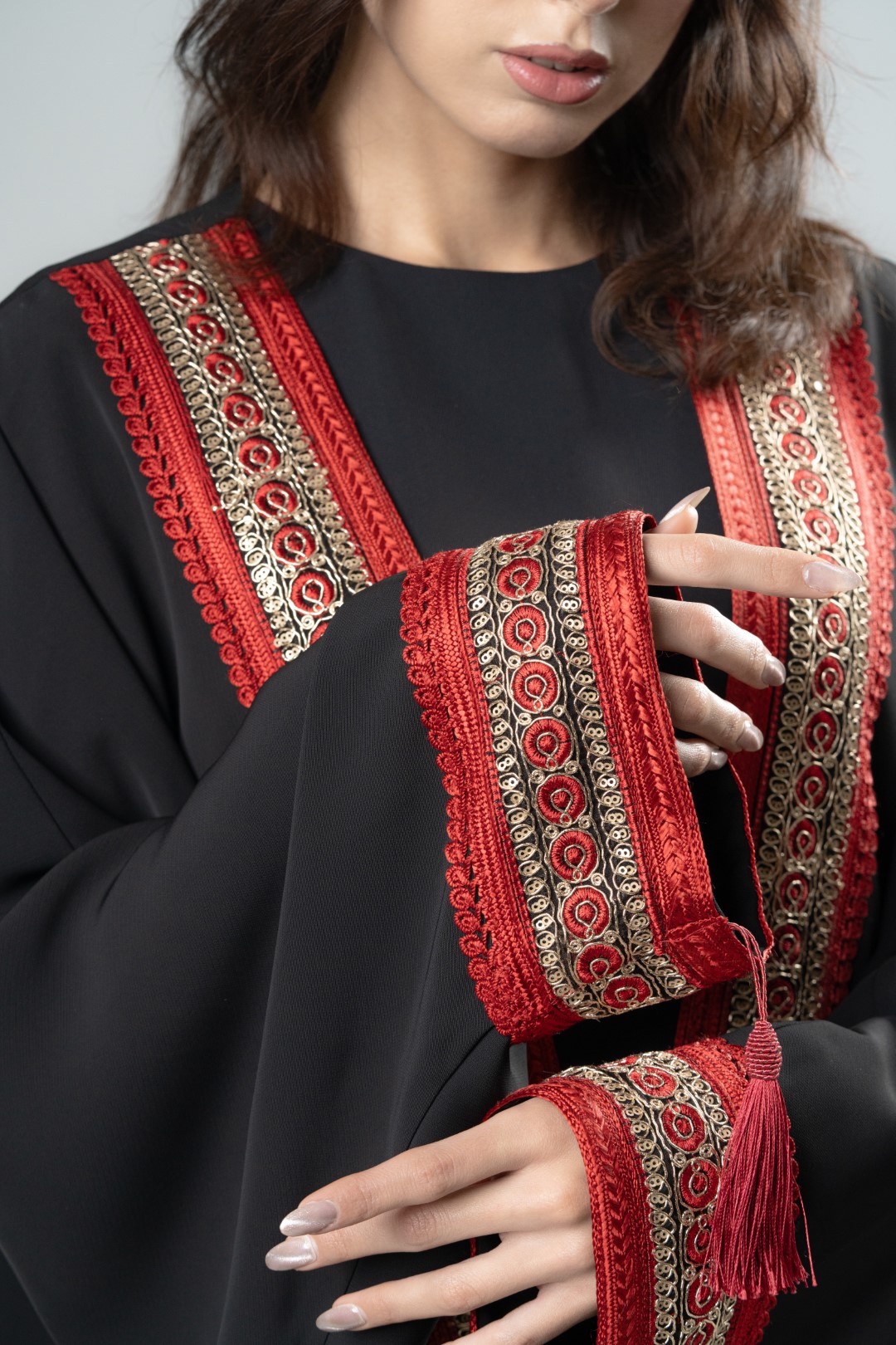 Black kimono with red tassels
