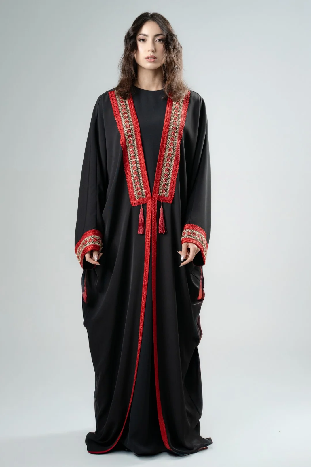 Black kimono with red tassels