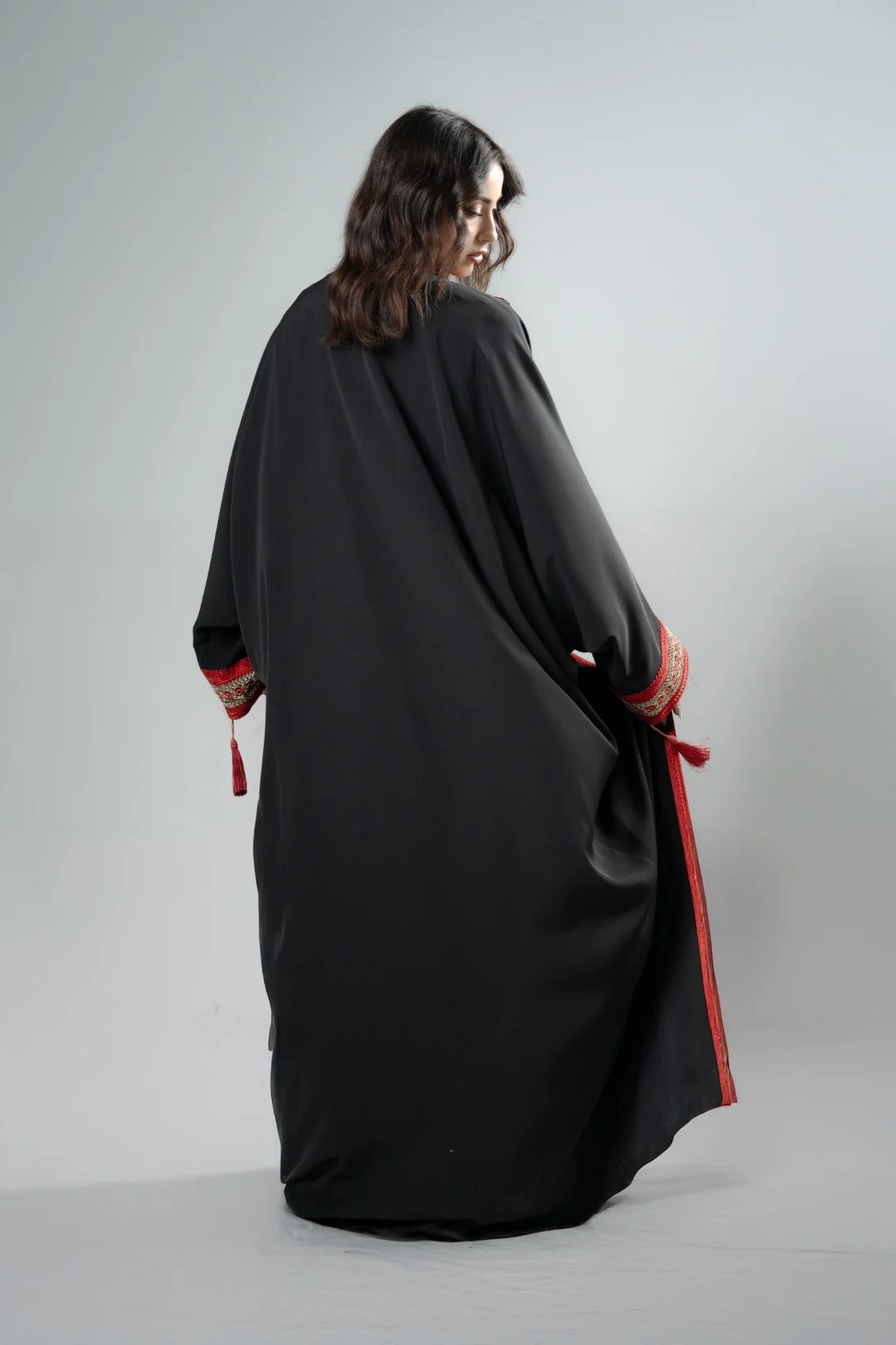 Black kimono with red tassels