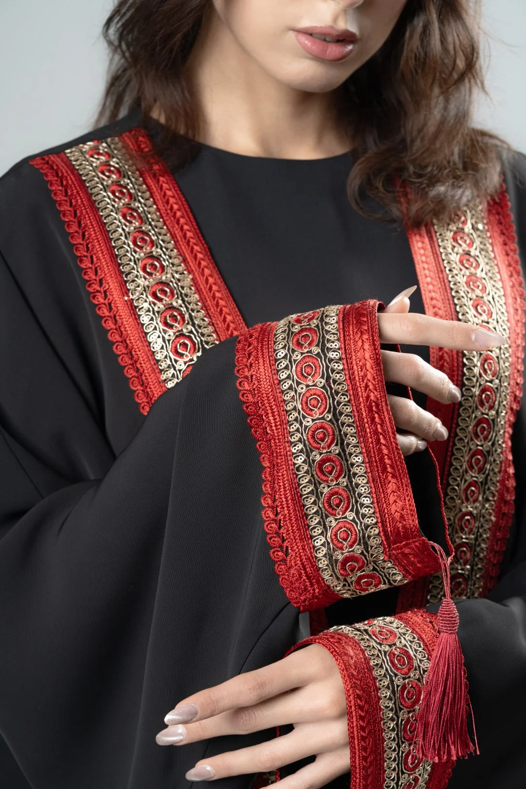 Black kimono with red tassels